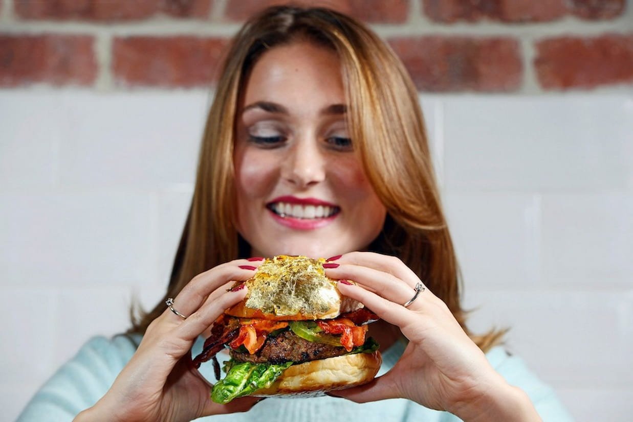 A girl showing homemade Burger Styles